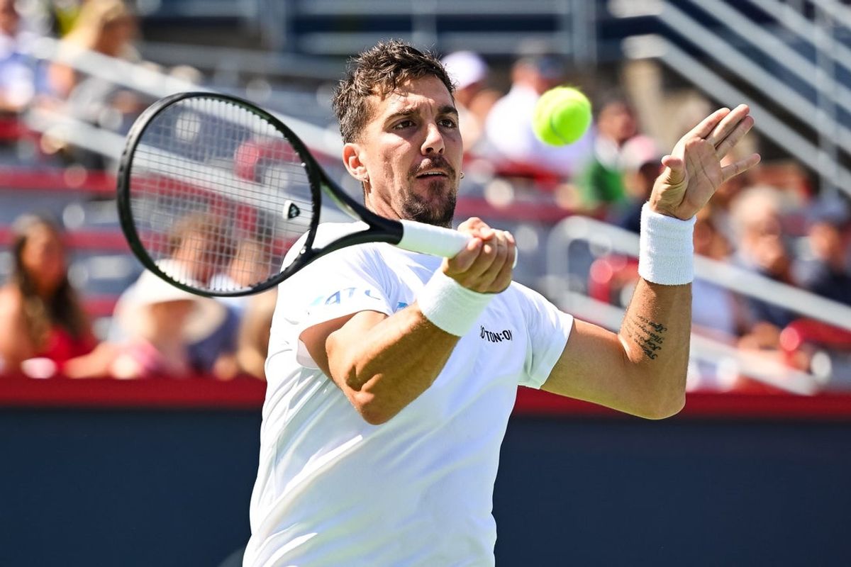 Aug 10, 2024; Montreal, Quebec, Canada; Thanasi Kokkinakis (AUS) returns the ball to Hubert Hurkacz (POL) (not pictured) in second round play at IGA Stadium. Mandatory Credit: David Kirouac-Imagn Images