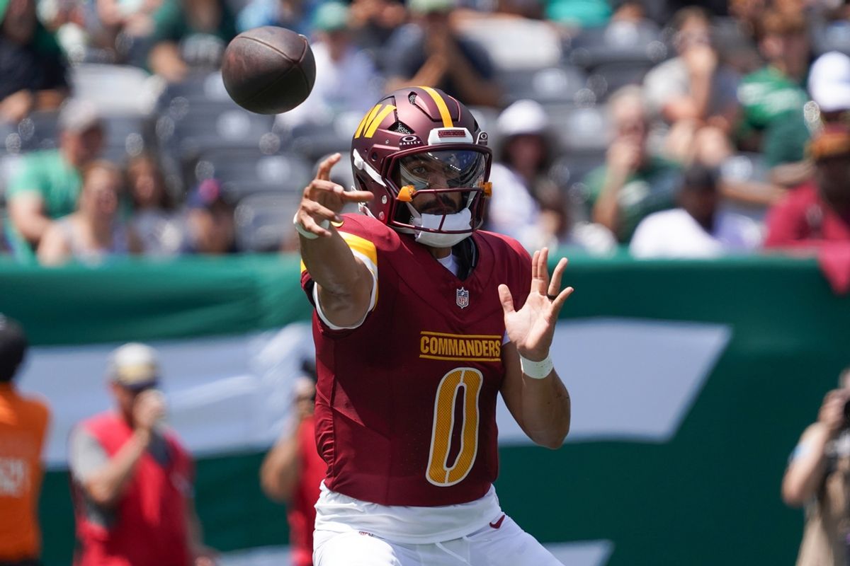 Aug 10, 2024; East Rutherford, New Jersey, USA; Washington Commanders quarterback Marcus Mariota (0) passes during the first quarter against the New York Jets at MetLife Stadium. Mandatory Credit: Lucas Boland-Imagn Images