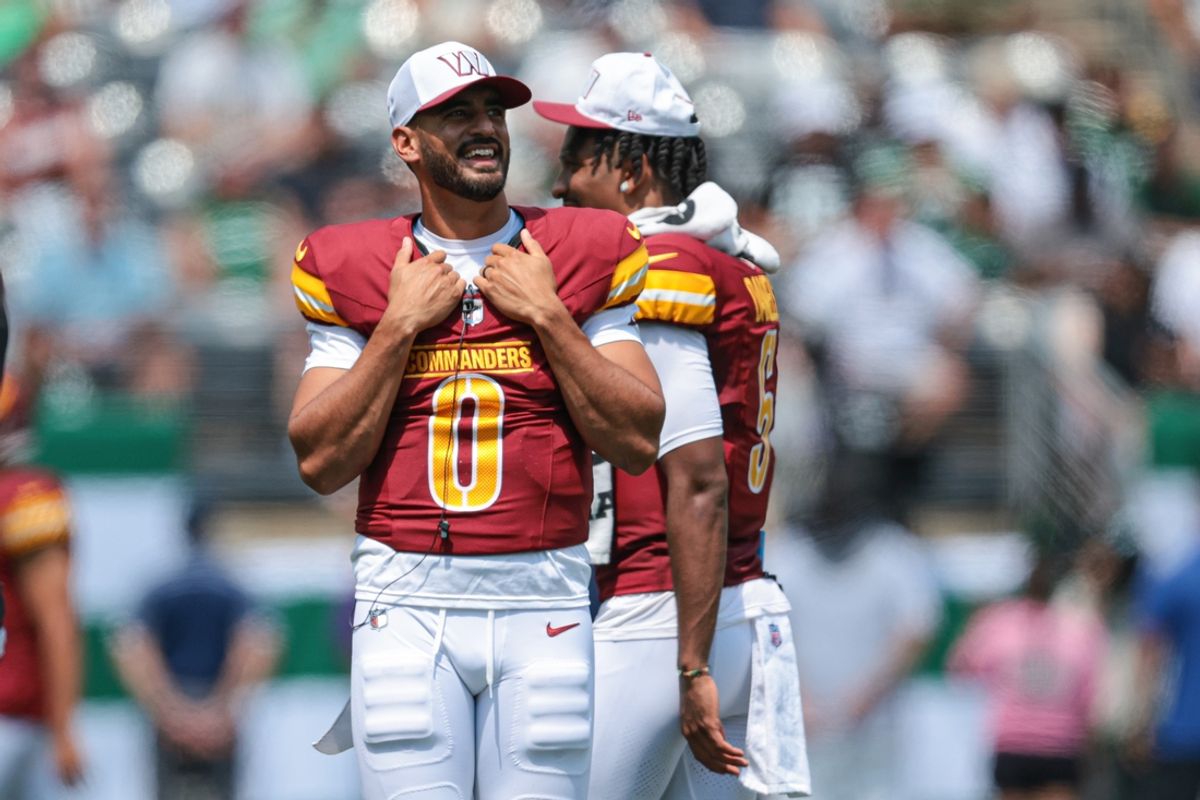 Aug 10, 2024; East Rutherford, New Jersey, USA; Washington Commanders quarterback Marcus Mariota (0) looks on during the first half against the New York Jets at MetLife Stadium. Mandatory Credit: Vincent Carchietta-Imagn Images