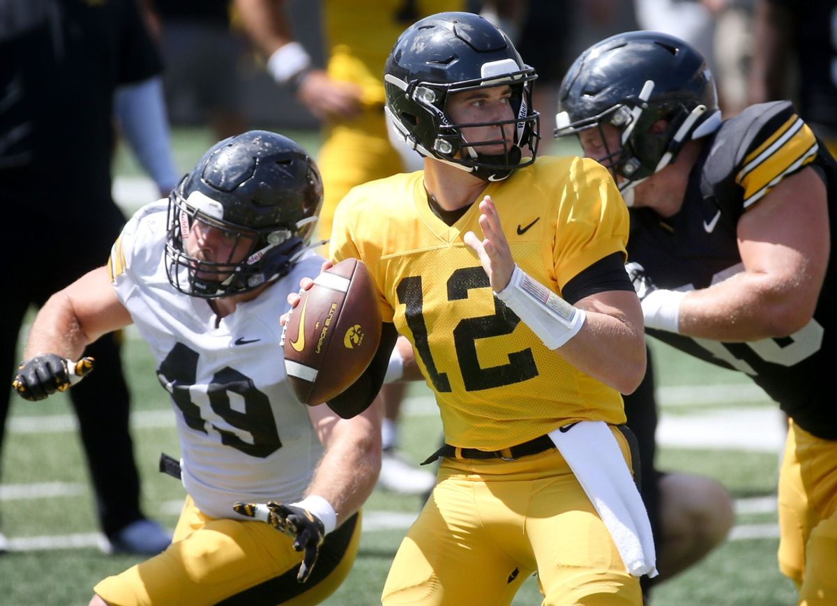 Iowa’s Cade McNamara (12) looks to throw during Kids Day at Kinnick Saturday, Aug. 10, 2024 at Kinnick Stadium in Iowa City, Iowa.