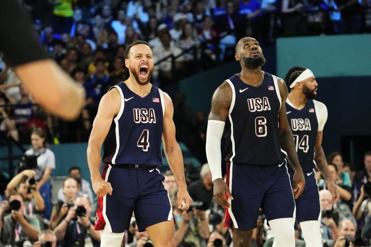 Aug 10, 2024; Paris, France; United States shooting guard Stephen Curry (4) and guard LeBron James (6) react in the second half against France in the men's basketball gold medal game during the Paris 2024 Olympic Summer Games at Accor Arena. Mandatory Credit: Rob Schumacher-Imagn Images