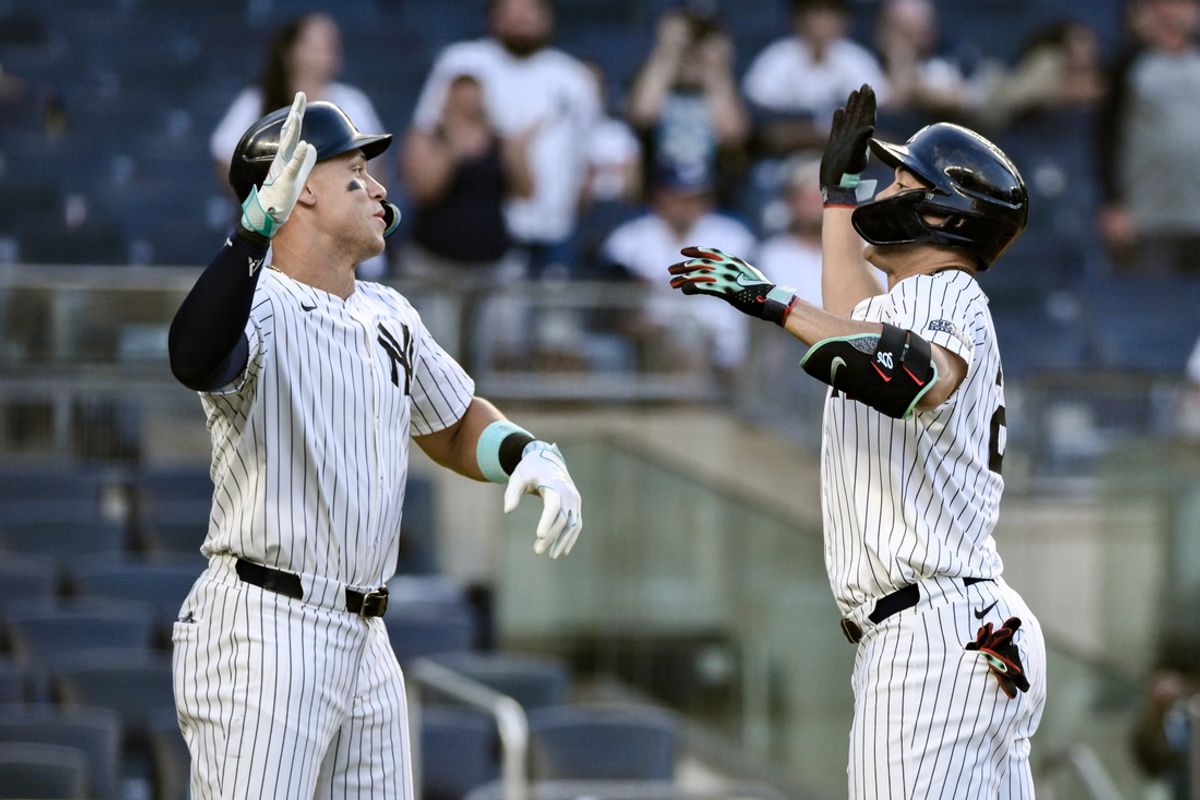 Aug 10, 2024; Bronx, New York, USA; New York Yankees designated hitter Giancarlo Stanton (27) high fives New York Yankees outfielder Aaron Judge (99) after hitting a two run home run against the Texas Rangers during the eighth inning at Yankee Stadium. Mandatory Credit: John Jones-USA TODAY Sports