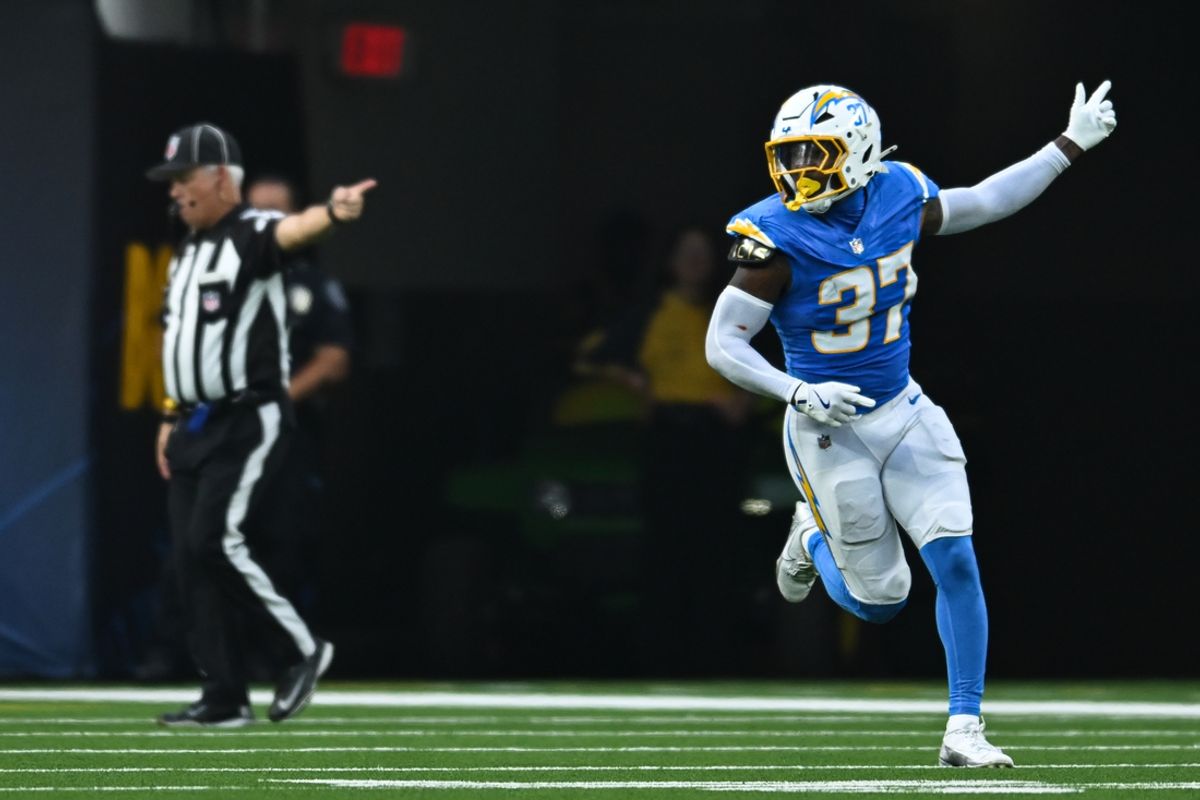 Aug 10, 2024; Inglewood, California, USA; Los Angeles Chargers safety Tony Jefferson (37) scores a touchdown against the Seattle Seahawks during the third quarter at SoFi Stadium. Mandatory Credit: Jonathan Hui-Imagn Images