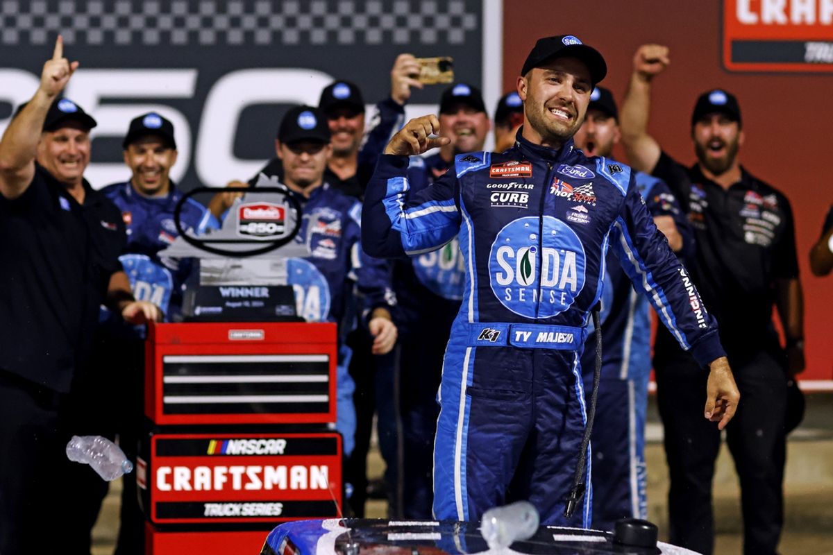Aug 10, 2024; Richmond, Virginia, USA; Craftsman Truck Series driver Ty Majeski (98) celebrates winning the Clean Harbors 250 at Richmond Raceway. Mandatory Credit: Peter Casey-USA TODAY Sports