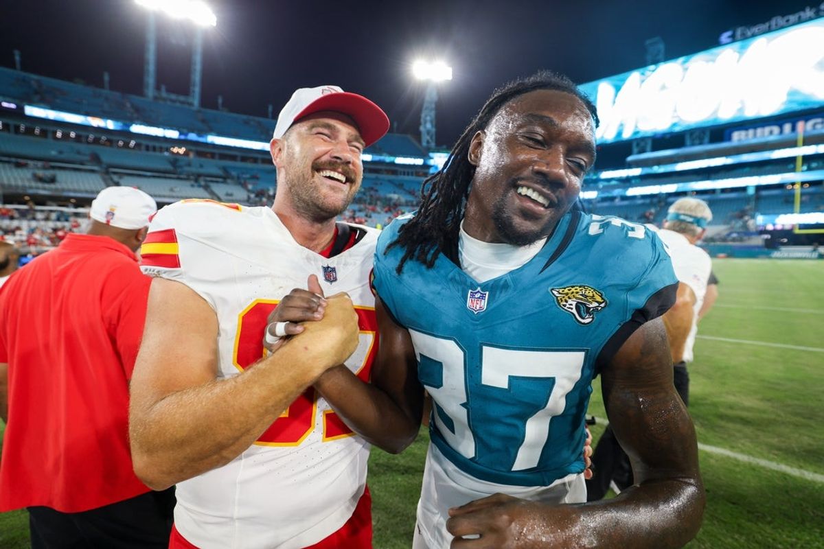 Aug 10, 2024; Jacksonville, Florida, USA; Kansas City Chiefs tight end Travis Kelce (87) greets Jacksonville Jaguars cornerback Tre Flowers (37) after a preseason game at EverBank Stadium. Mandatory Credit: Nathan Ray Seebeck-Imagn Images