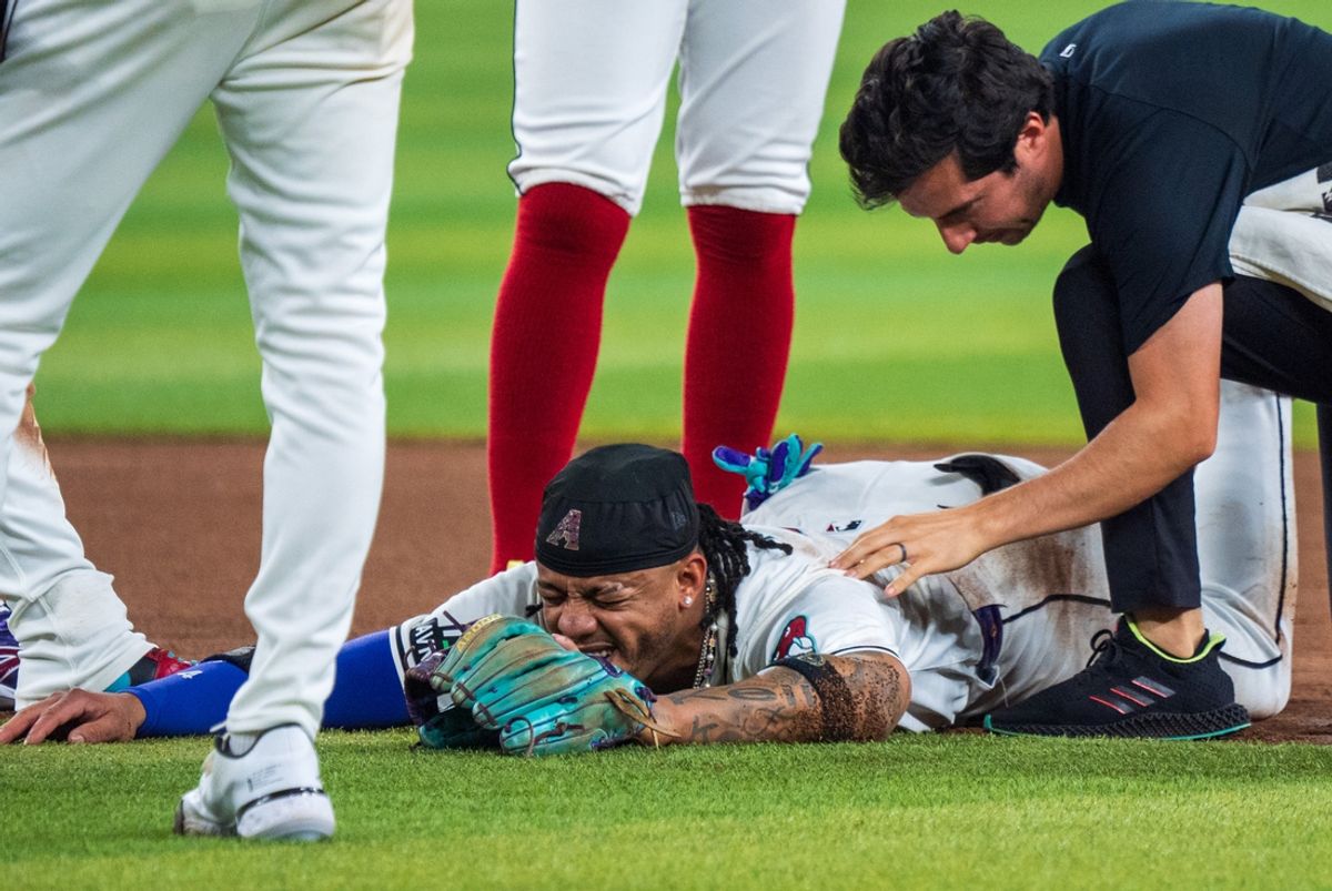 Aug 10, 2024; Phoenix, Arizona, USA; Arizona Diamondbacks infielder Ketel Marte (4) reacts after a collision with Philadelphia Phillies catcher Garrett Stubbs (21) (not shown) at second base in the fourth inning during a game against the Philadelphia Phillies at Chase Field. Mandatory Credit: Allan Henry-Imagn Images