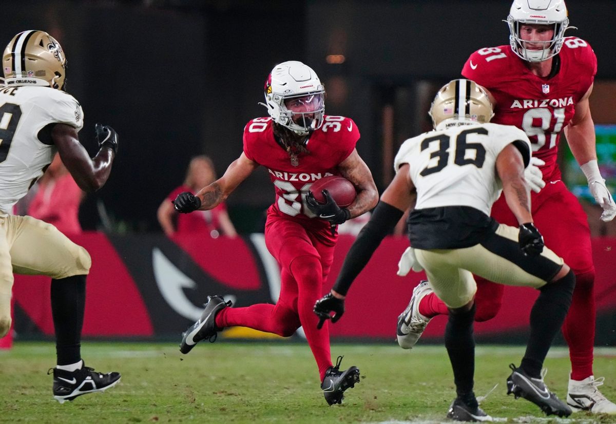 Cardinals wide out Xavier Weaver (30) runs with the ball against the Saints during a game at State Farm Stadium in Glendale, Ariz., on Saturday, Aug. 10, 2024.