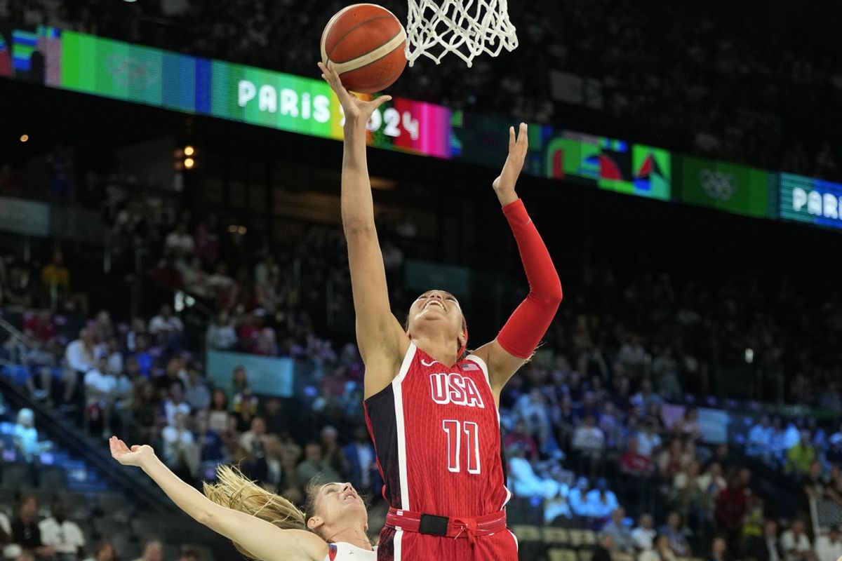 Aug 11, 2024; Paris, France; United States small forward Napheesa Collier (11) shoots against France point guard Romane Bernies (47) in the first half in the women's gold medal game during the Paris 2024 Olympic Summer Games at Accor Arena. Mandatory Credit: Kyle Terada-USA TODAY Sports