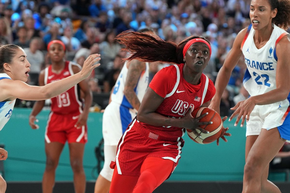 Aug 11, 2024; Paris, France; United States forward Kahleah Copper (7) controls the ball against France point guard Marine Fauthoux (4) and centre Marieme Badiane (22) in the second half in the women's gold medal game during the Paris 2024 Olympic Summer Games at Accor Arena. Mandatory Credit: James Lang-USA TODAY Sports