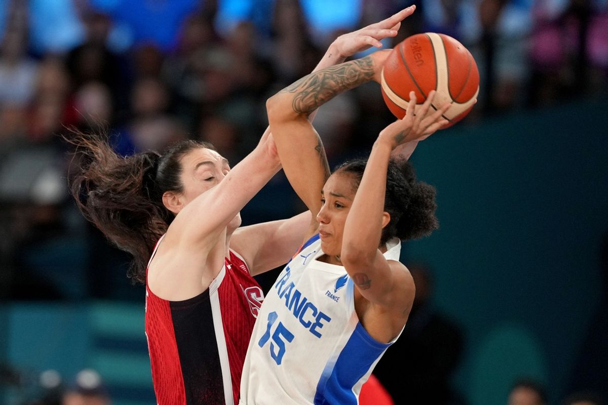 Aug 11, 2024; Paris, France; France forward Gabby Williams (15) passes against United States power forward Breanna Stewart (10) in the second half in the women's gold medal game during the Paris 2024 Olympic Summer Games at Accor Arena. Mandatory Credit: James Lang-USA TODAY Sports