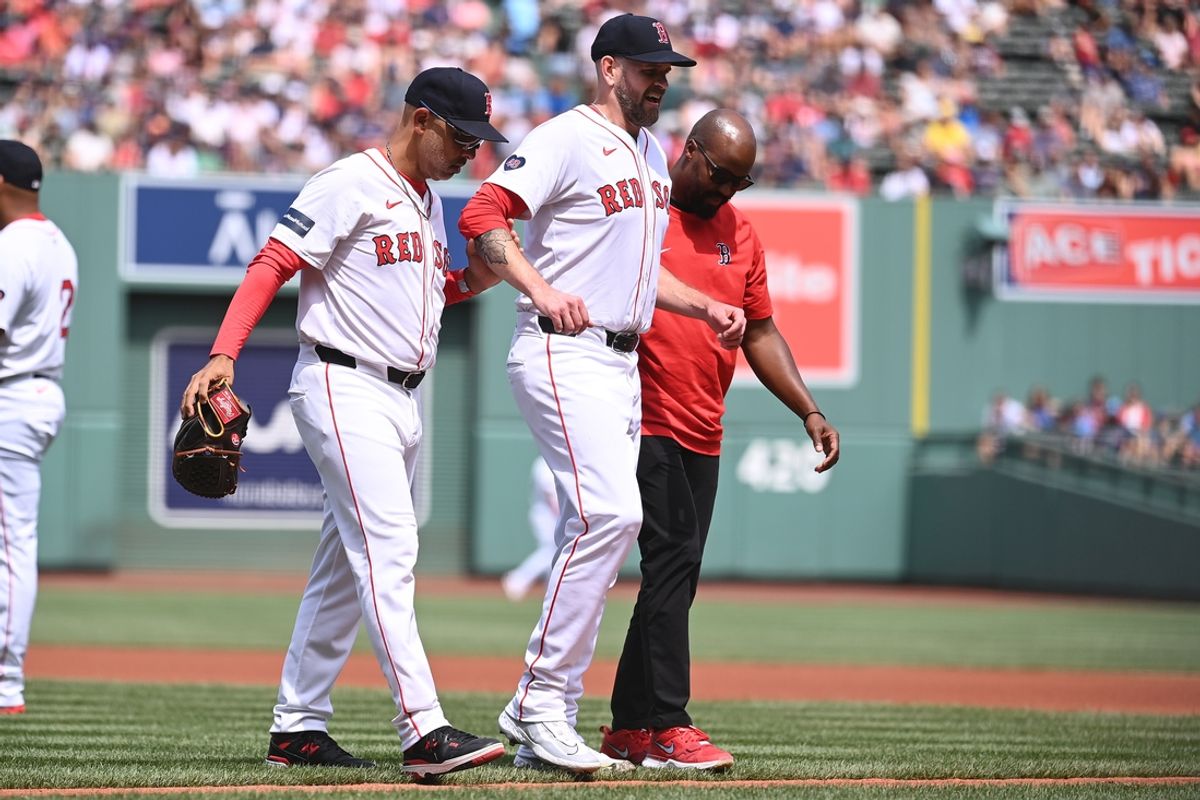 Aug 11, 2024; Boston, Massachusetts, USA; Boston Red Sox starting pitcher James Paxton (65) is helped off the field by manager Alex Cora (13) (l) and medical staff during the first inning against the Houston Astros at Fenway Park. Mandatory Credit: Eric Canha-USA TODAY Sports