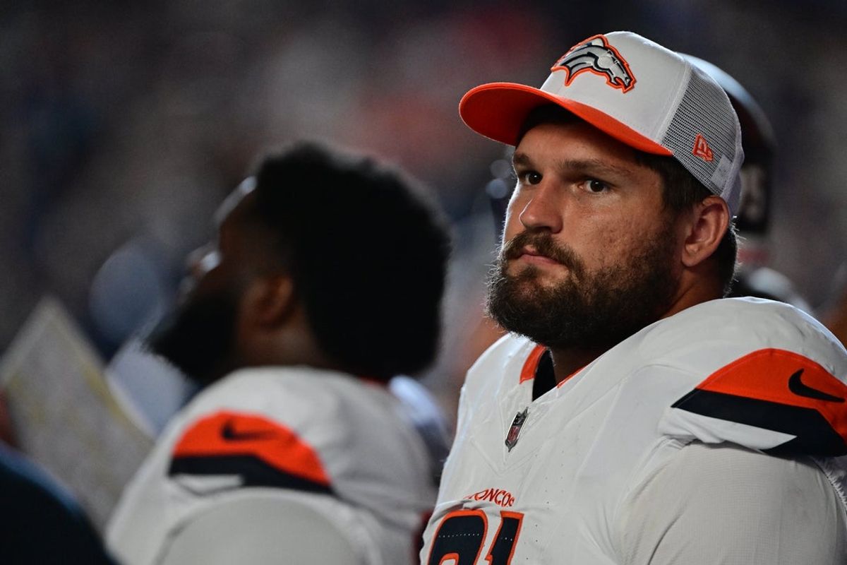 Aug 11, 2024; Indianapolis, Indiana, USA; Denver Broncos defensive end Matt Henningsen (91) stands near the bench before the game against the Indianapolis Colts at Lucas Oil Stadium. Mandatory Credit: Marc Lebryk-Imagn Images