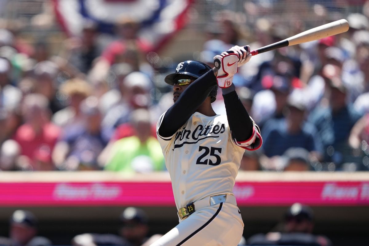 Aug 11, 2024; Minneapolis, Minnesota, USA; Minnesota Twins center fielder Byron Buxton (25) hits a solo home run during the second inning against the Cleveland Guardians at Target Field. Mandatory Credit: Jordan Johnson-Imagn Images