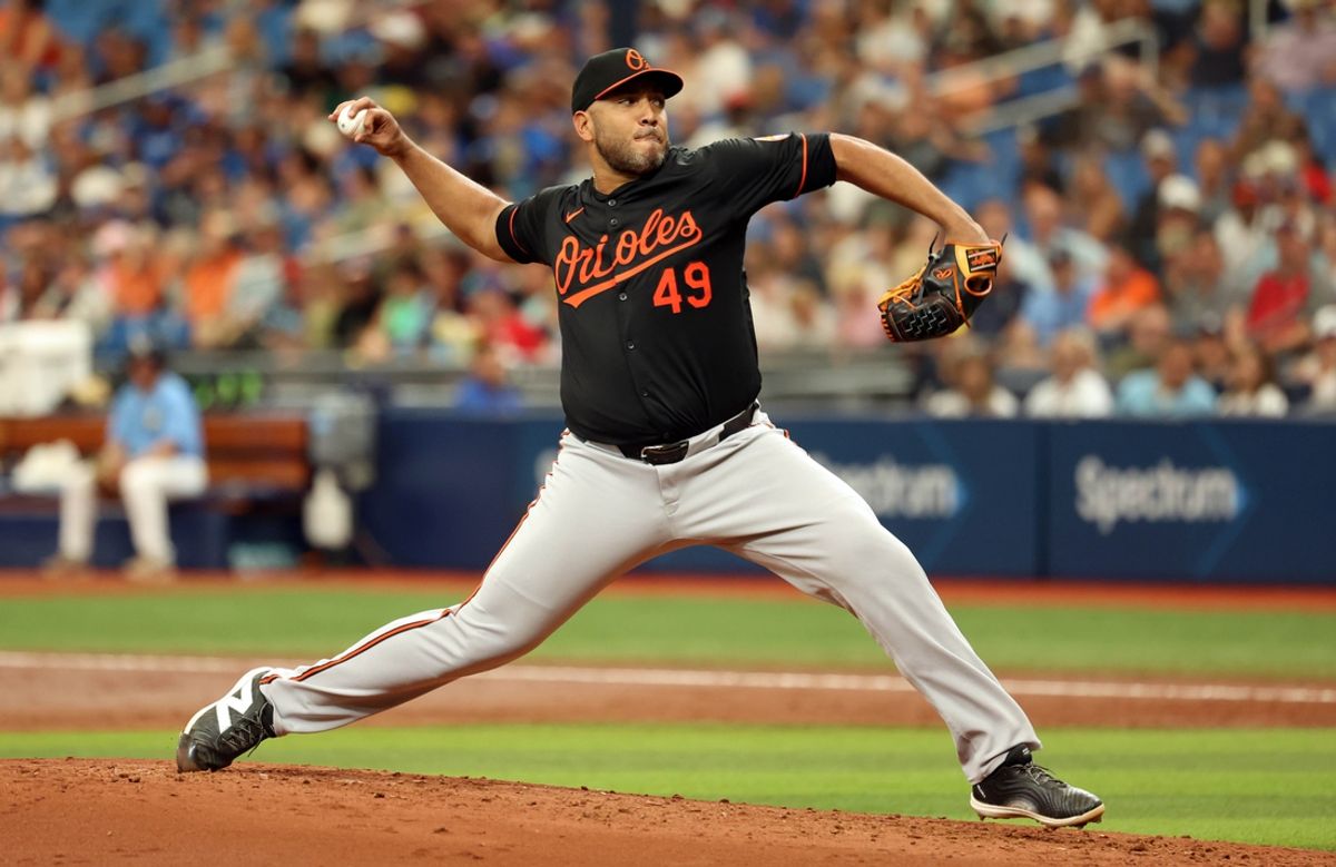 Aug 11, 2024; St. Petersburg, Florida, USA; Baltimore Orioles starting pitcher Albert Suarez (49) throws a pitch against the Tampa Bay Rays during the second inning at Tropicana Field. Mandatory Credit: Kim Klement Neitzel-Imagn Images