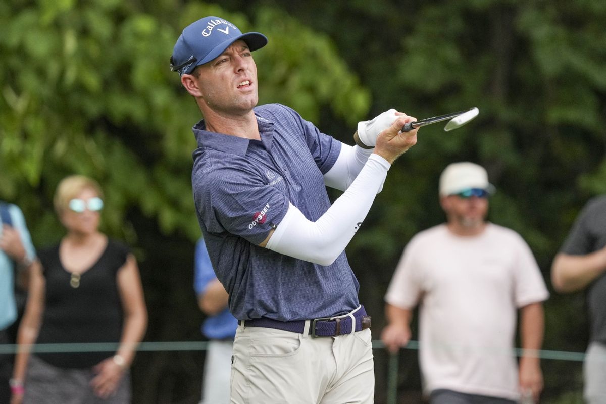 Aug 11, 2024; Greensboro, North Carolina, USA; Max Greyserman hits his tee shot on two green during the fourth round of the Wyndham Championship golf tournament at Sedgefield Country Club. Mandatory Credit: Jim Dedmon-Imagn Images