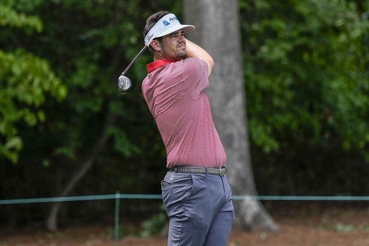 Aug 11, 2024; Greensboro, North Carolina, USA; Beau Hossler hits his tee shot on two during the fourth round of the Wyndham Championship golf tournament at Sedgefield Country Club. Mandatory Credit: Jim Dedmon-Imagn Images