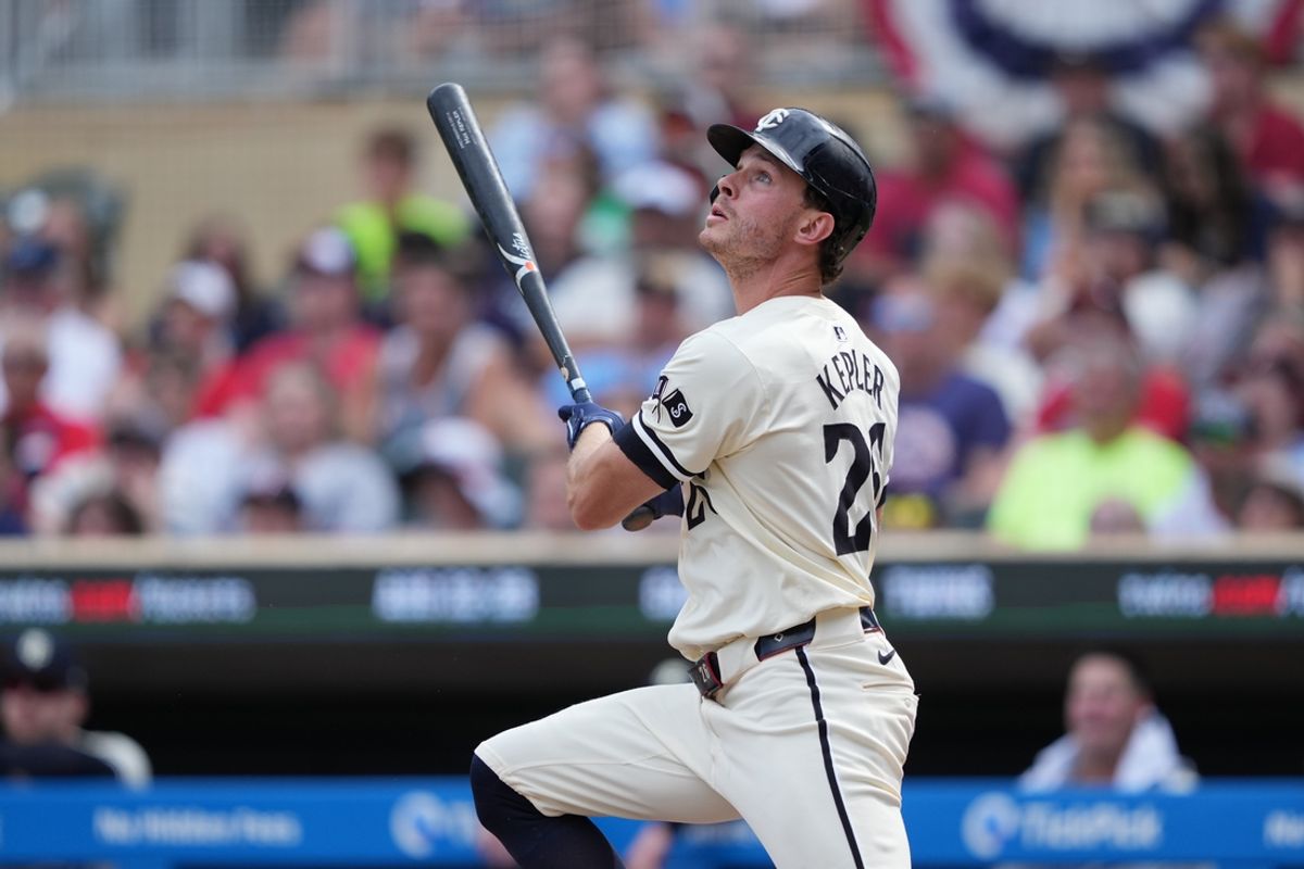 Aug 11, 2024; Minneapolis, Minnesota, USA; Minnesota Twins right fielder Max Kepler (26) hits a single during the ninth inning against the Cleveland Guardians at Target Field. Mandatory Credit: Jordan Johnson-Imagn Images