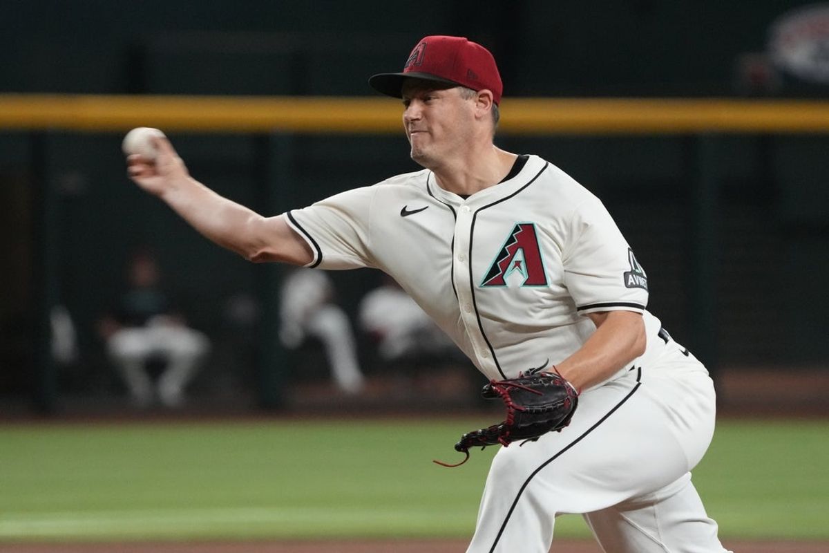 Aug 11, 2024; Phoenix, Arizona, USA; Arizona Diamondbacks pitcher Paul Sewald (38) throws against the Philadelphia Phillies in the ninth inning at Chase Field. Mandatory Credit: Rick Scuteri-Imagn Images