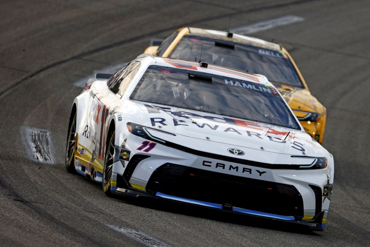 Aug 11, 2024; Richmond, Virginia, USA; NASCAR Cup Series driver Denny Hamlin (11) leads NASCAR Cup Series driver Christopher Bell (20) during the Cook Out 400 at Richmond Raceway. Mandatory Credit: Peter Casey-USA TODAY Sports