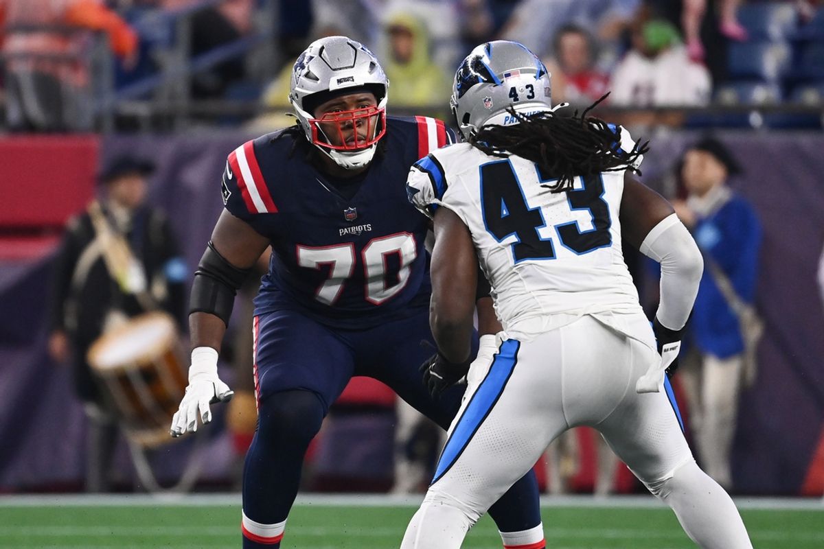 August 8, 2024; Foxborough, MA, USA;  New England Patriots offensive tackle Caedan Wallace (70) lines up with Carolina Panthers linebacker Luiji Vilain (43) during the first half at Gillette Stadium. Mandatory Credit: Eric Canha-Imagn Images