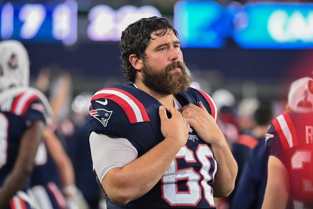August 8, 2024; Foxborough, MA, USA;  New England Patriots center David Andrews (60) watches from the sideline during the first half against the Carolina Panthers at Gillette Stadium. Mandatory Credit: Eric Canha-Imagn Images