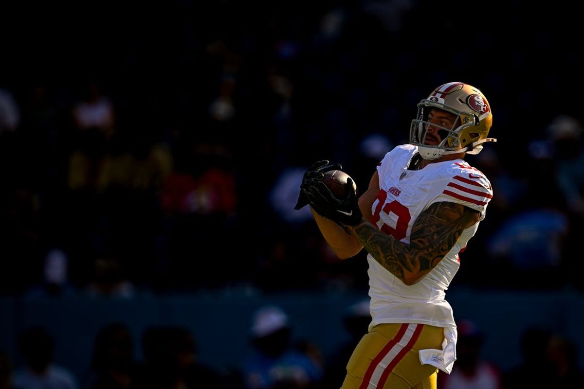 Aug 10, 2024; Nashville, Tennessee, USA;  San Francisco 49ers tight end Eric Saubert (82) makes a catch against the Tennessee Titans during pregame warmups at Nissan Stadium. Mandatory Credit: Steve Roberts-Imagn Images