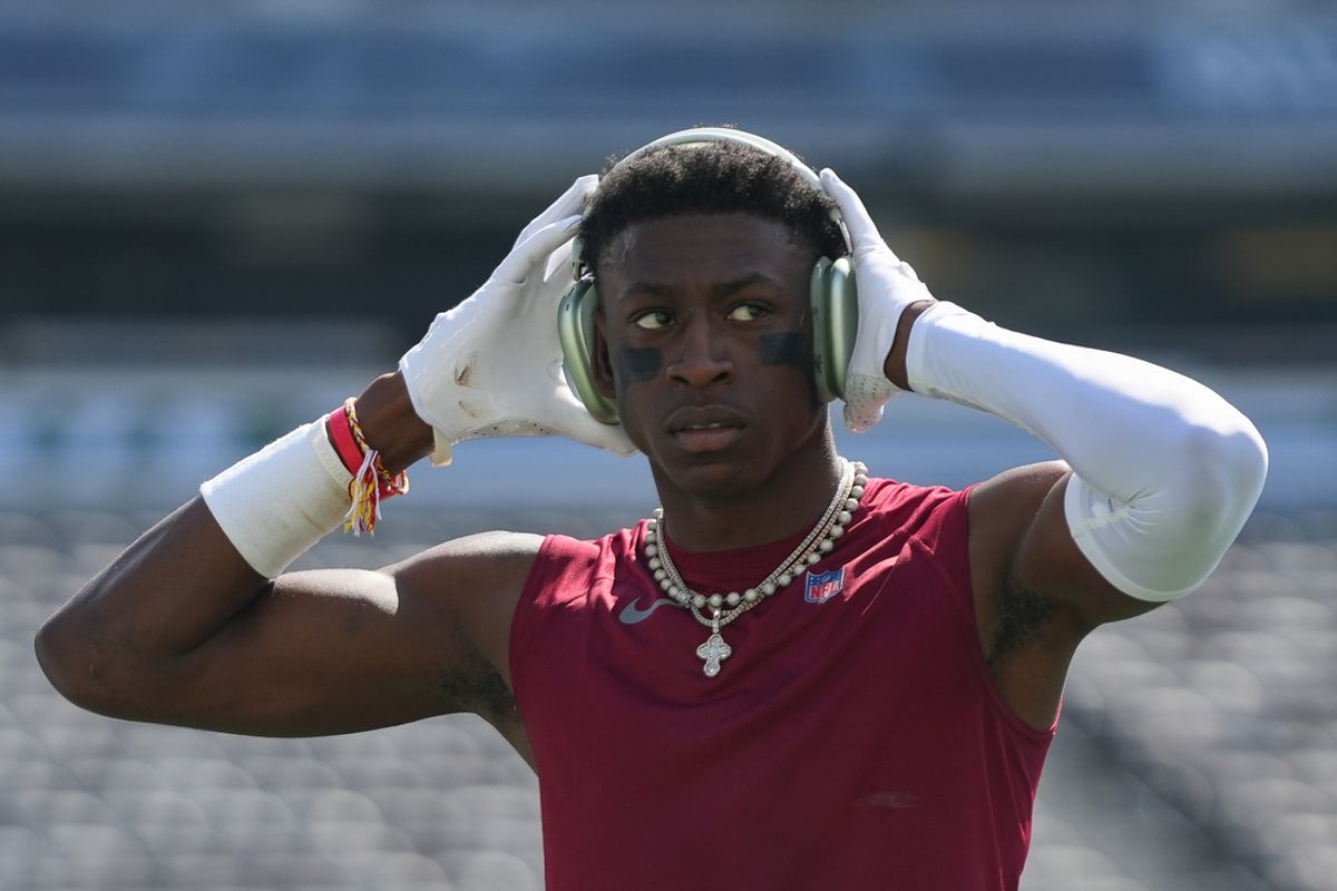 Aug 10, 2024; East Rutherford, New Jersey, USA; Washington Commanders cornerback Emmanuel Forbes (13) warms up before the game against the New York Jets at MetLife Stadium. Mandatory Credit: Lucas Boland-Imagn Images
