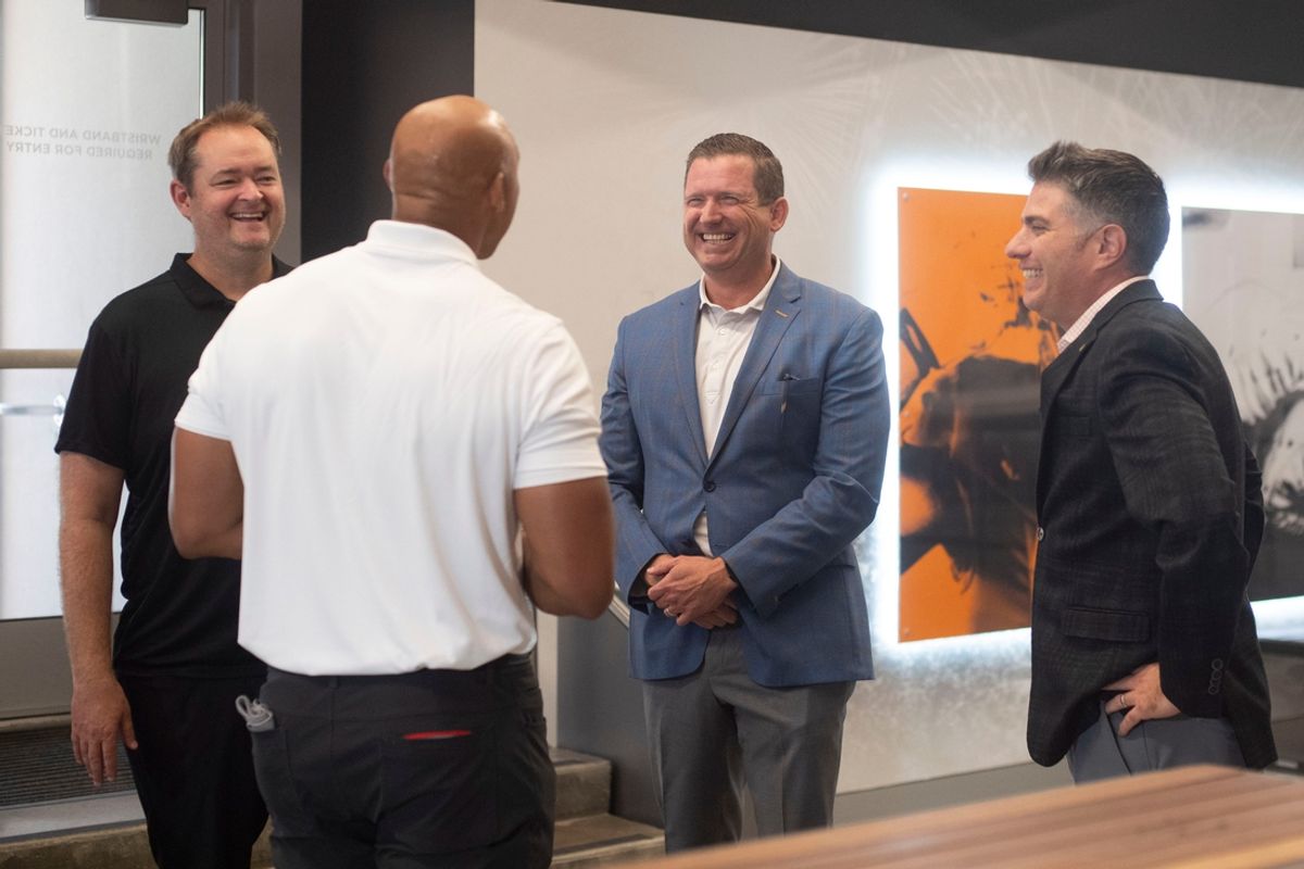 From left, Tennessee football coach Josh Heupel, Athletic Director Danny White, and Chief Communications Officer Jason Baum chat with Pilot CEO Adam Wright after the announcement of a branding partnership between Pilot and Neyland Stadium on Tuesday, Aug. 13, 2024.