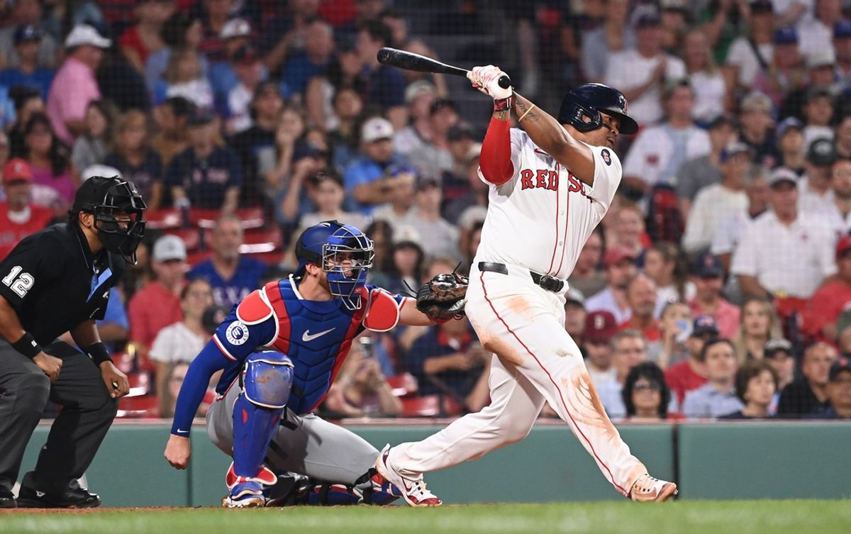 Aug 13, 2024; Boston, Massachusetts, USA; Boston Red Sox third baseman Rafael Devers (11) hits a single against the Texas Rangers during the fourth inning at Fenway Park. Mandatory Credit: Eric Canha-USA TODAY Sports