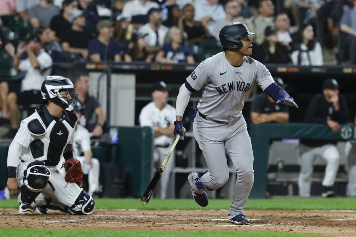 Aug 13, 2024; Chicago, Illinois, USA; New York Yankees outfielder Juan Soto (22) hits a solo home run against the Chicago White Sox during the fifth inning at Guaranteed Rate Field. Mandatory Credit: Kamil Krzaczynski-USA TODAY Sports