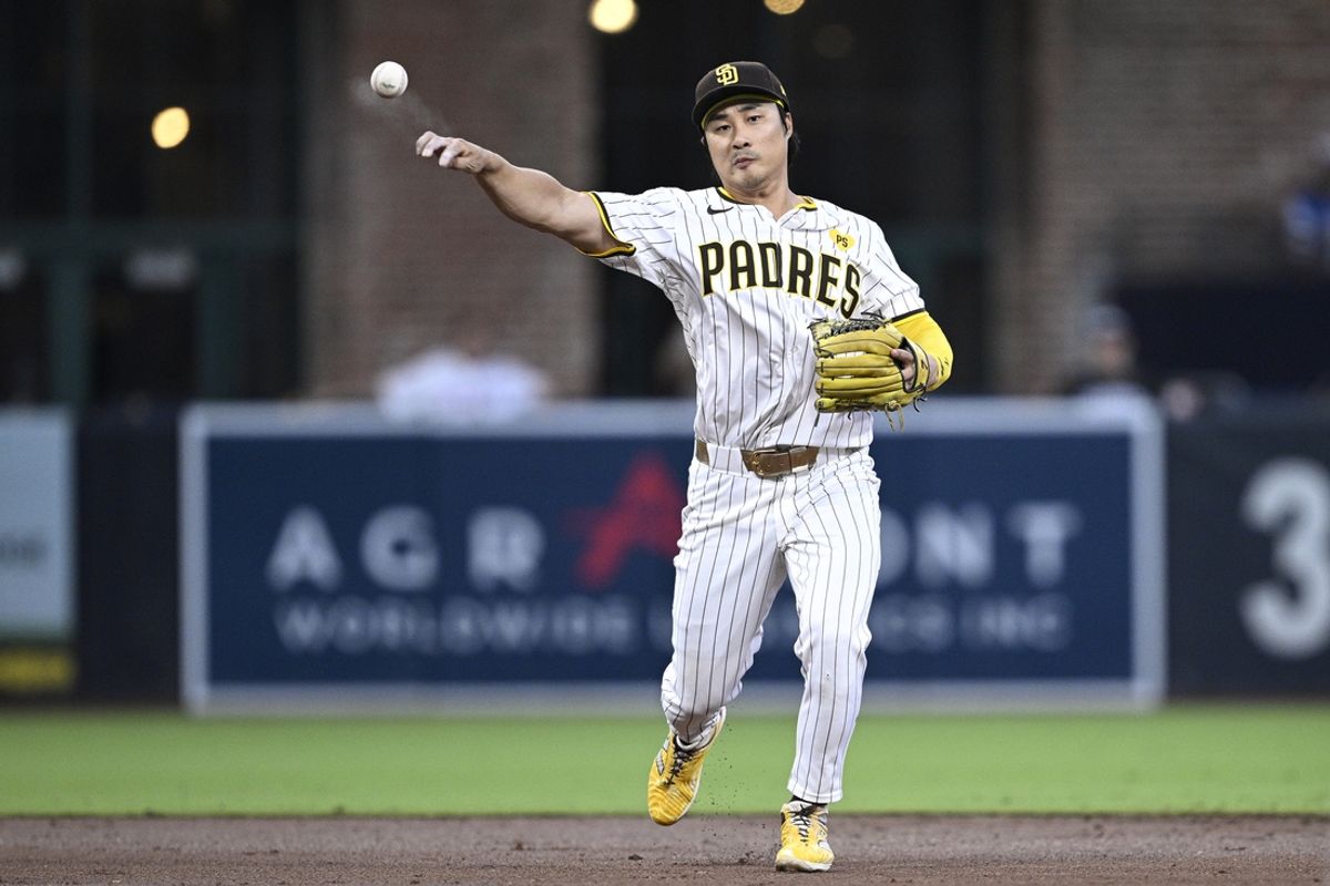 Aug 13, 2024; San Diego, California, USA; San Diego Padres shortstop Ha-Seong Kim (7) throws to first base against the Pittsburgh Pirates during the third inning at Petco Park. Mandatory Credit: Orlando Ramirez-Imagn Images