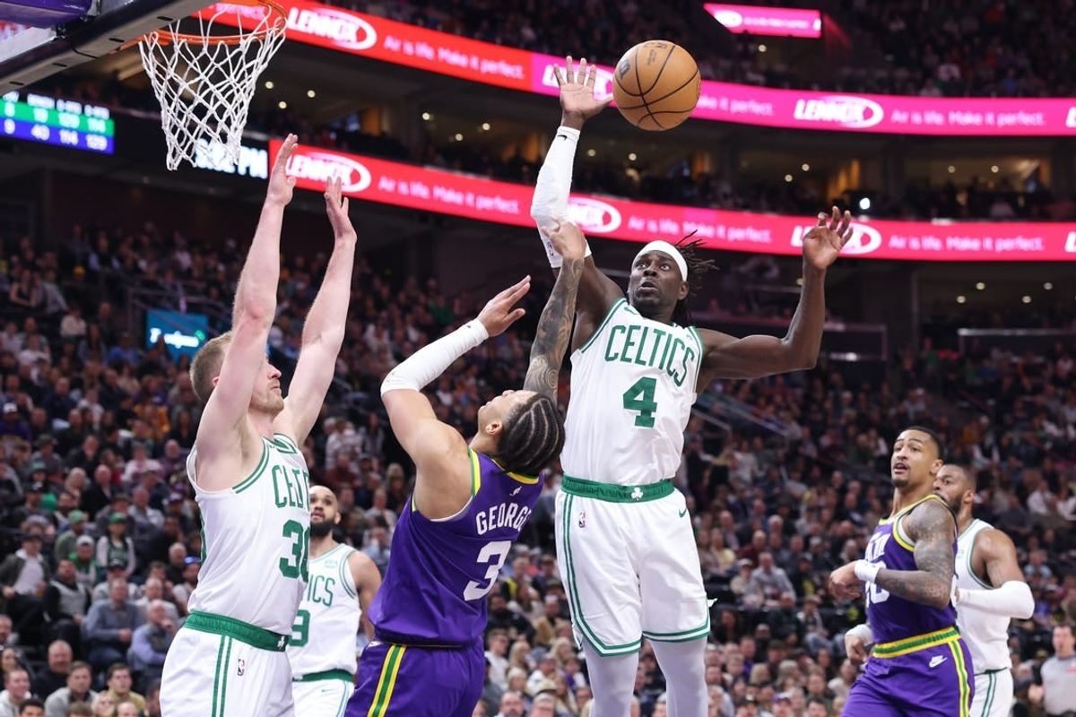 Mar 12, 2024; Salt Lake City, Utah, USA; Utah Jazz guard Keyonte George (3) drives into Boston Celtics forward Sam Hauser (30) and has the shot blocked by guard Jrue Holiday (4) during the fourth quarter at Delta Center.