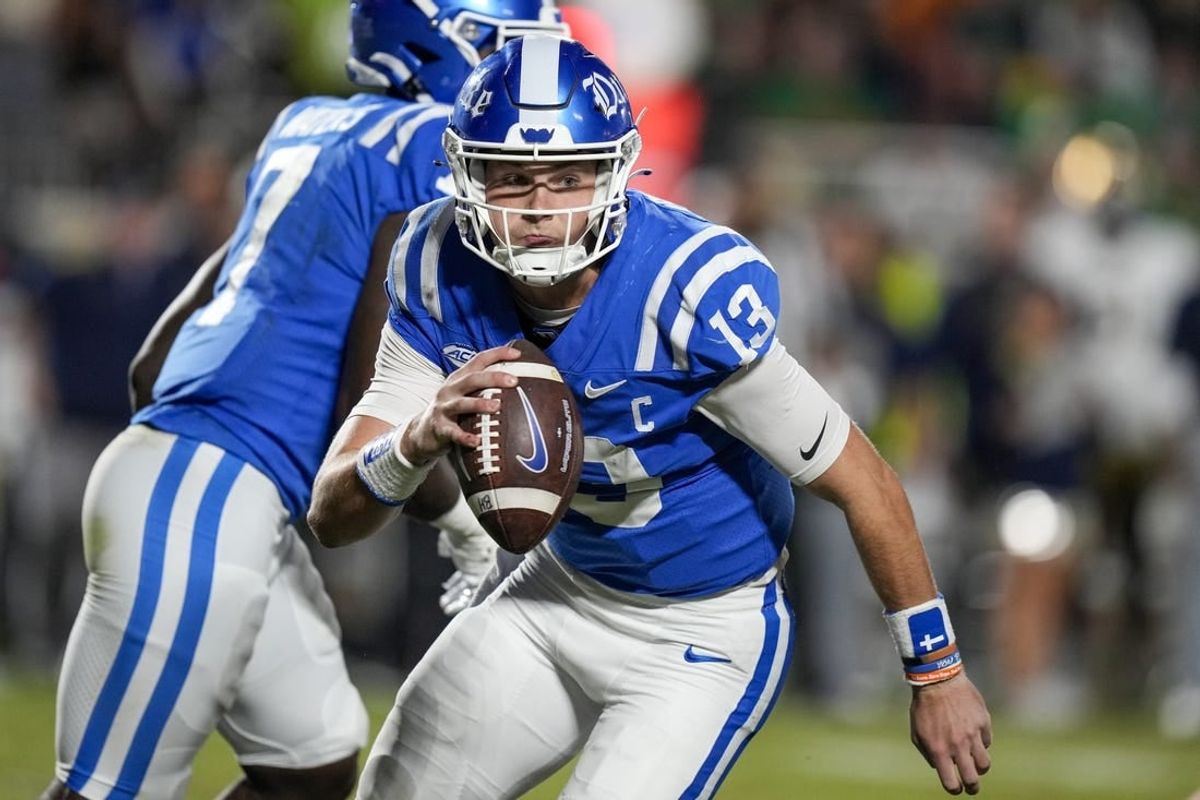 Sep 30, 2023; Durham, North Carolina, USA; Duke Blue Devils quarterback Riley Leonard (13) is forced to run during the second quarter against the Notre Dame Fighting Irish at Wallace Wade Stadium.