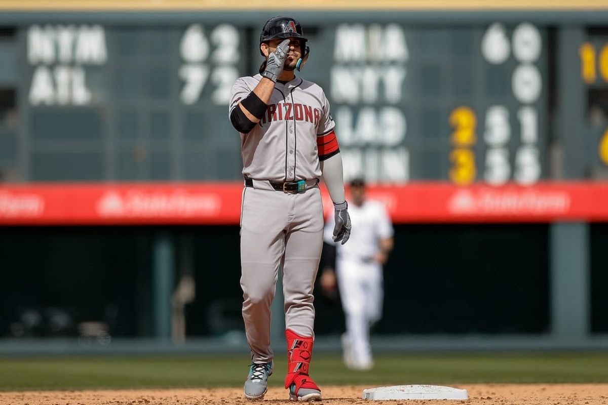 Apr 10, 2024; Denver, Colorado, USA; Arizona Diamondbacks third baseman Eugenio Suarez (28) reacts from second on a two RBI double in the ninth inning against the Colorado Rockies at Coors Field.