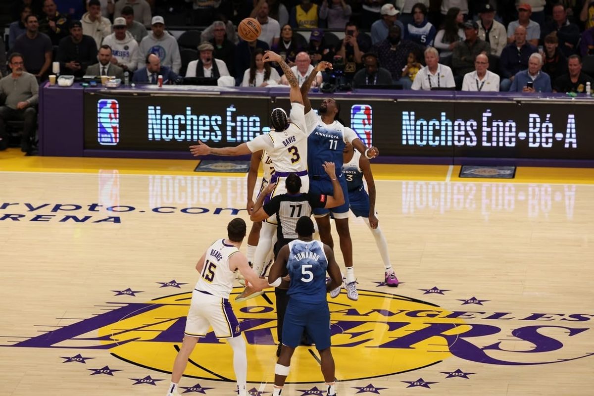 Mar 10, 2024; Los Angeles, California, USA;  Los Angeles Lakers forward Anthony Davis (3) and Minnesota Timberwolves center Naz Reid (11) tip off during the first quarter at Crypto.com Arena.
