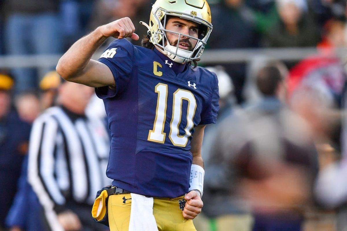 Nov 18, 2023; South Bend, Indiana, USA; Notre Dame Fighting Irish quarterback Sam Hartman (10) celebrates after throwing a touchdown pass in the second quarter against the Wake Forest Demon Deacons at Notre Dame Stadium.