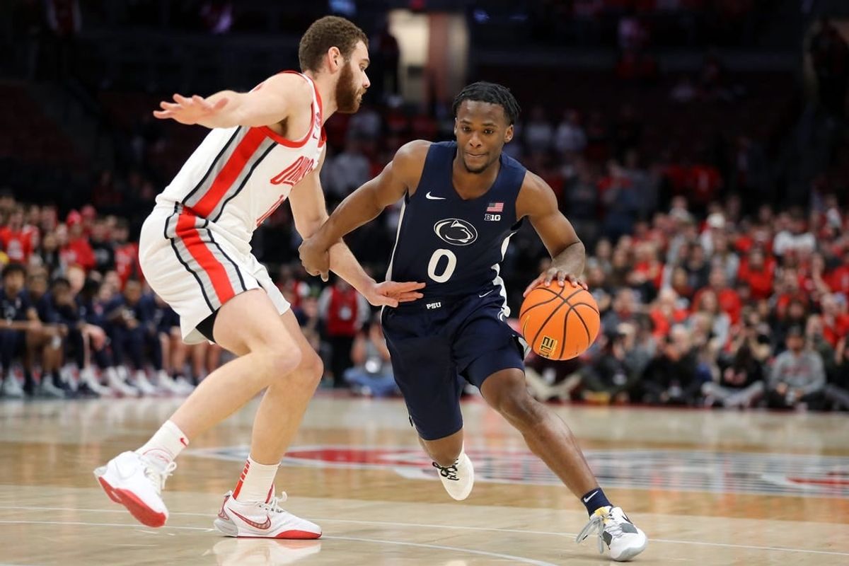 Jan 20, 2024; Columbus, Ohio, USA;  Penn State Nittany Lions guard Kanye Clary (0) controls the ball  as Ohio State Buckeyes forward Jamison Battle (10) defends during the first half at Value City Arena.