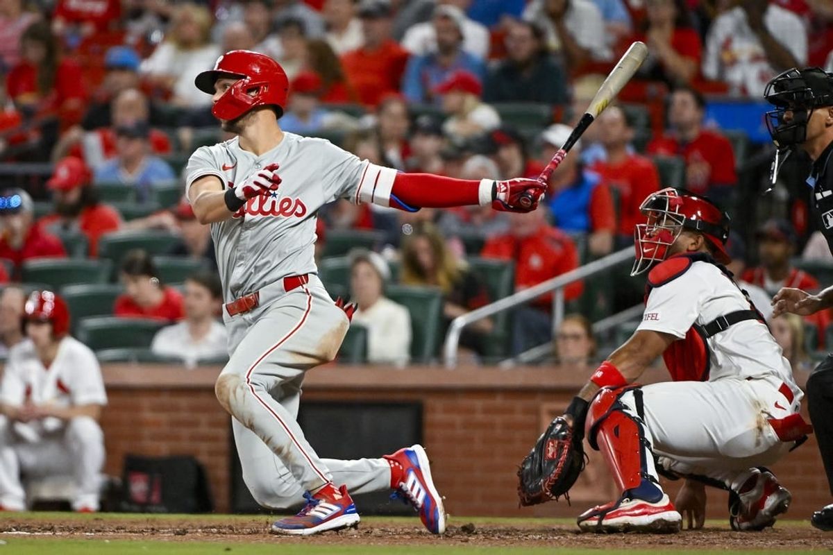 Apr 8, 2024; St. Louis, Missouri, USA;  Philadelphia Phillies shortstop Trea Turner (7) hits a one run single against the St. Louis Cardinals during the fifth inning at Busch Stadium.