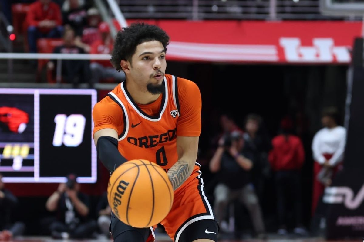 Jan 18, 2024; Salt Lake City, Utah, USA; Oregon State Beavers guard Jordan Pope (0) passes the ball against the Utah Utes during the first half at Jon M. Huntsman Center.