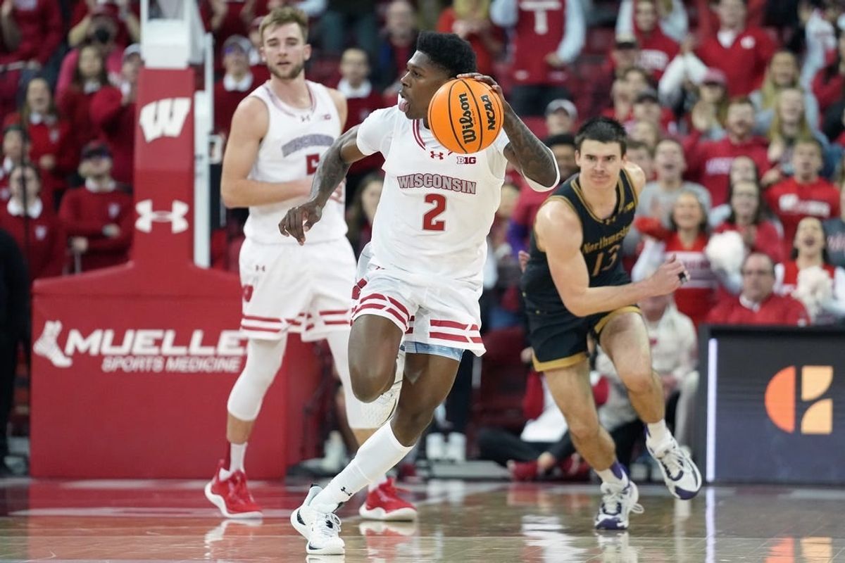 Jan 13, 2024; Madison, Wisconsin, USA; Wisconsin Badgers guard AJ Storr (2) dribbles the ball down the court following a turnover against Northwestern Wildcats during the second half at the Kohl Center.