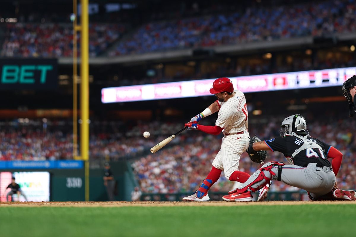 Aug 14, 2024; Philadelphia, Pennsylvania, USA; Philadelphia Phillies designated hitter Kyle Schwarber (12) hits a grand slam during the fourth inning against the Miami Marlins at Citizens Bank Park. Mandatory Credit: Bill Streicher-USA TODAY Sports
