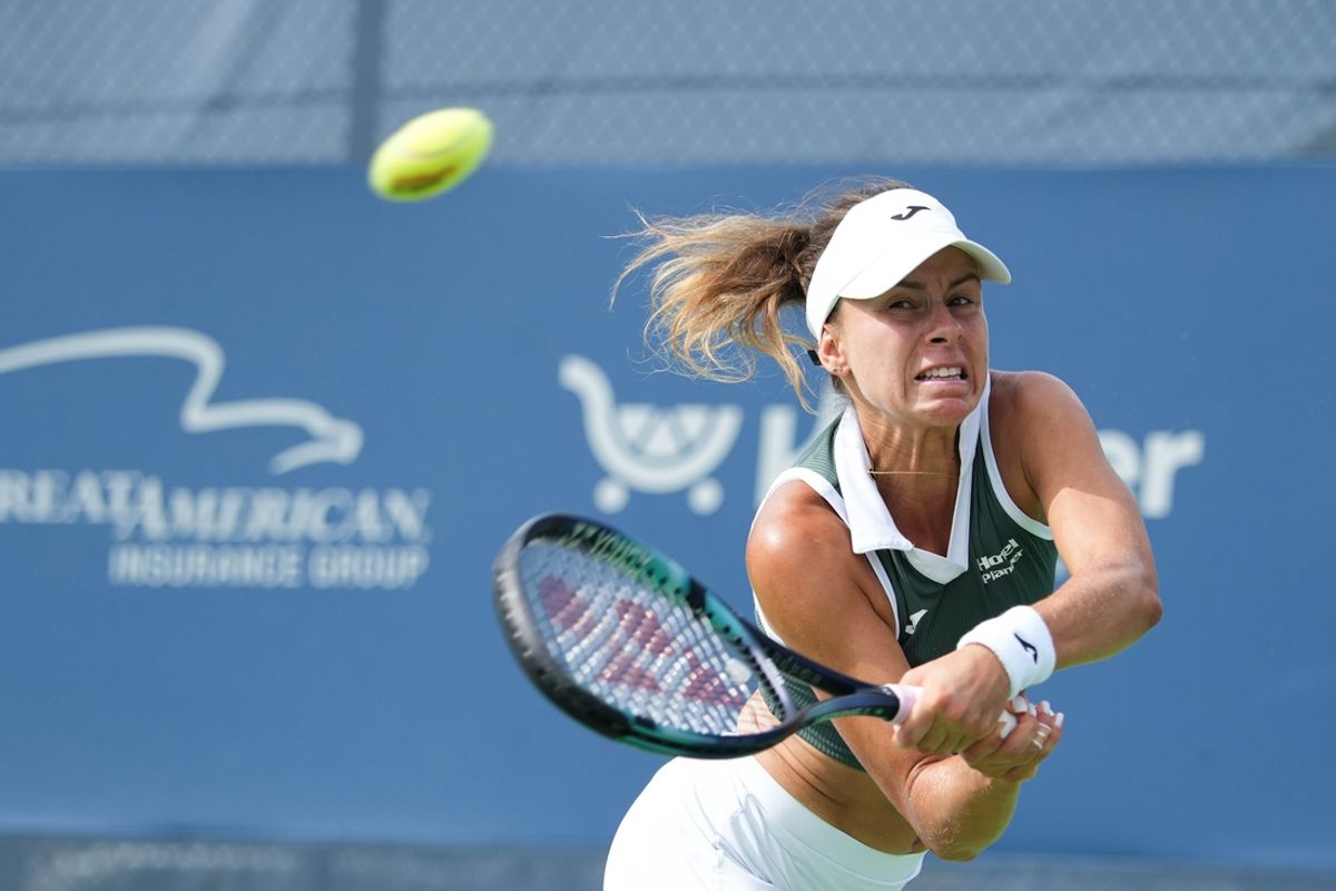 Poland's Magda Linette swings for the ball in her doubles match with USA's Peyton Stearns against Czech's Linda Nosková and Diana Shnaider on Thursday August 15, 2024 at the Lindner Family Tennis Center.