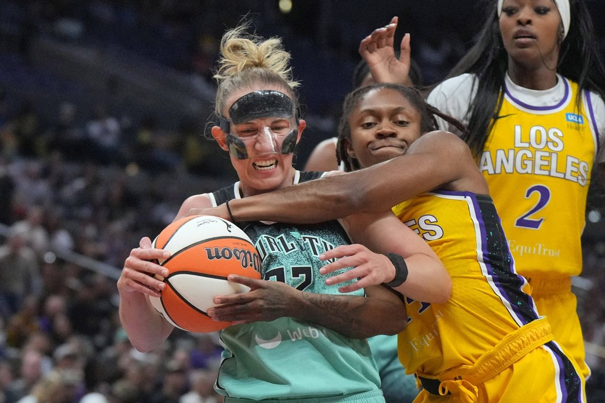 Aug 15, 2024; Los Angeles, California, USA; New York Liberty guard Courtney Vandersloot (22) and LA Sparks guard Crystal Dangerfield (14) battle for the ball in the first half at Crypto.com Arena. Mandatory Credit: Kirby Lee-USA TODAY Sports