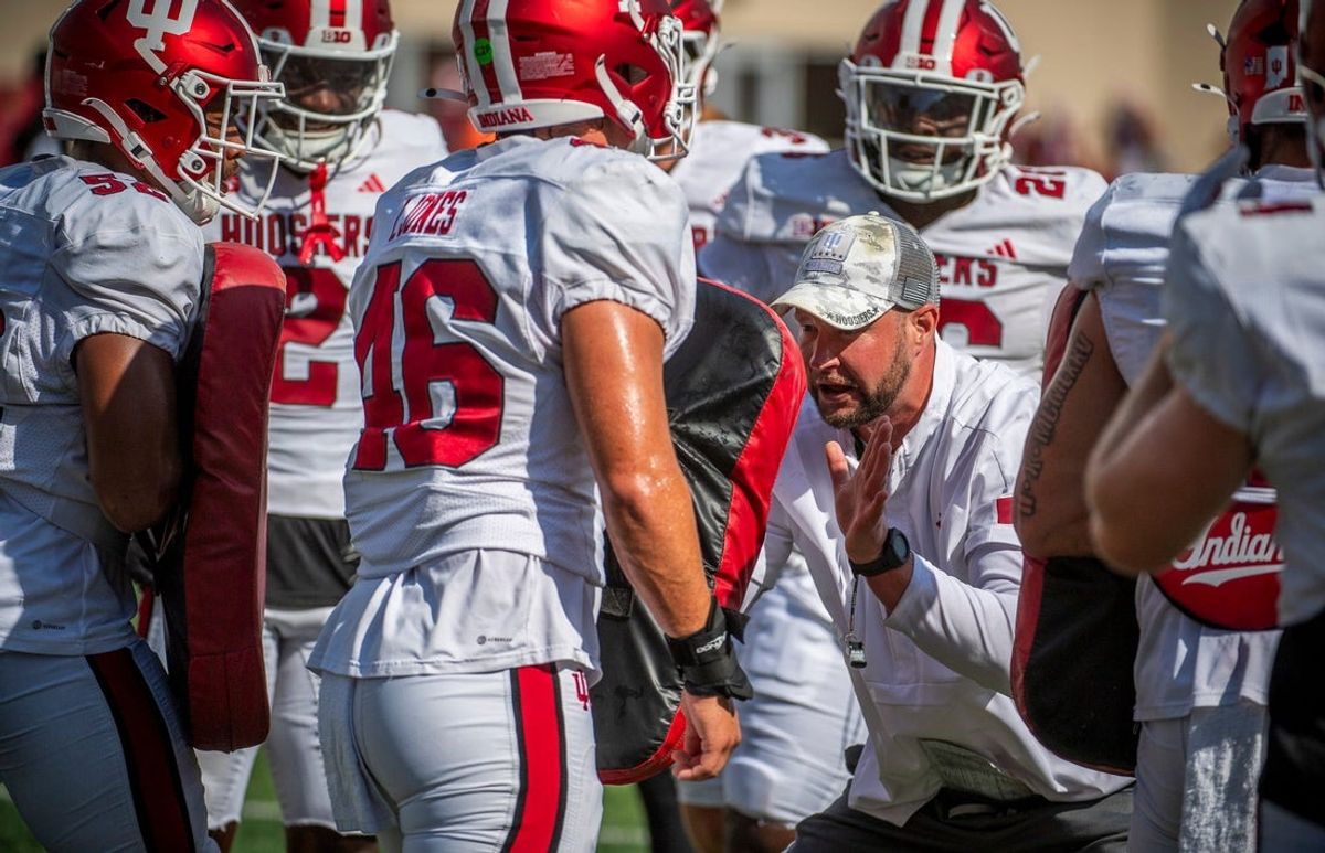 Indiana University Defensive Coordinator Bryant Haines instructs players during fall practice at the Mellencamp Pavilion at Indiana University on Friday, Aug. 16, 2024.