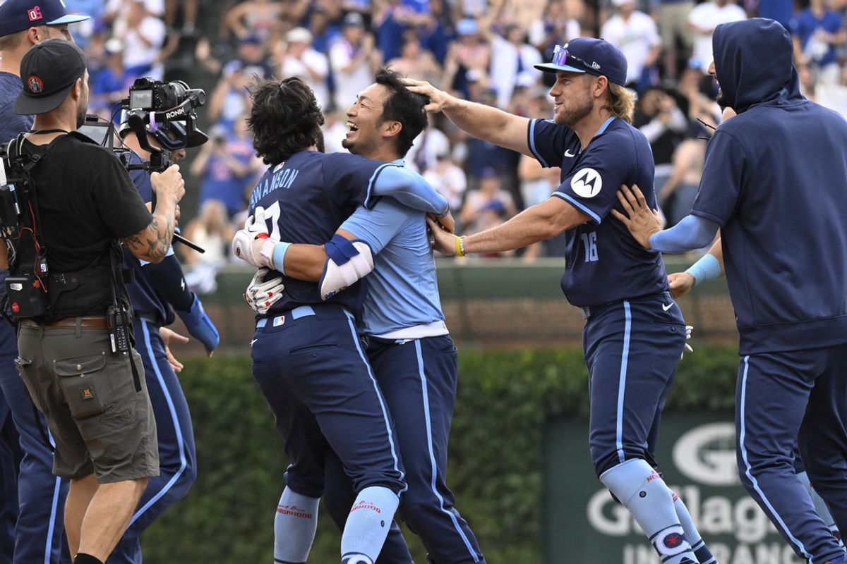 Aug 16, 2024; Chicago, Illinois, USA;  Chicago Cubs outfielder Seiya Suzuki (27) celebrates with shortstop Dansby Swanson (7) after hitting the game winning RBI single against the Toronto Blue Jays during the tenth inning at Wrigley Field. Mandatory Credit: Matt Marton-USA TODAY Sports