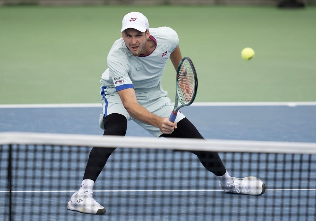 Aug 16, 2024; Cincinnati, OH, USA; Hubert Hurkacz of Poland returns a shot during his match against Flavio Cobolli of Italy on day five of the Cincinnati Open. Mandatory Credit: Susan Mullane-Imagn Images