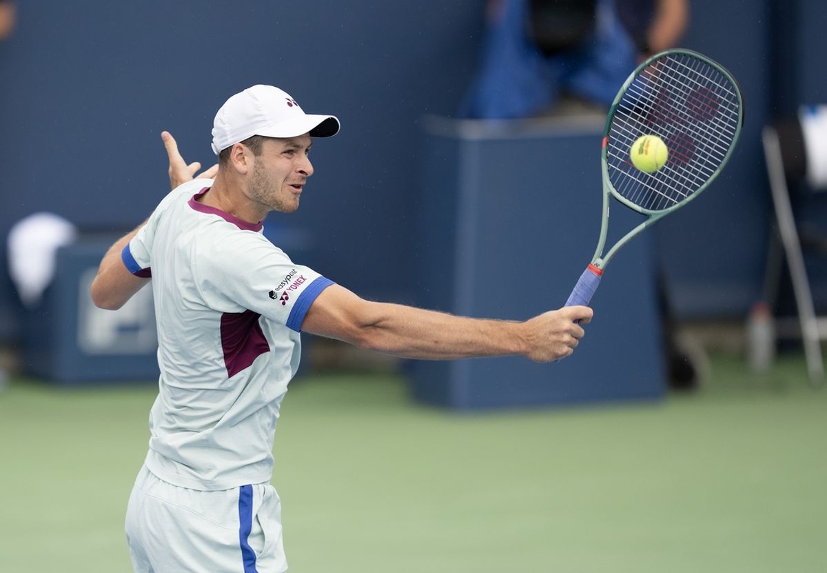 Aug 16, 2024; Cincinnati, OH, USA; Hubert Hurkacz of Poland returns a shot during his match against Flavio Cobolli of Italy on day five of the Cincinnati Open. Mandatory Credit: Susan Mullane-Imagn Images