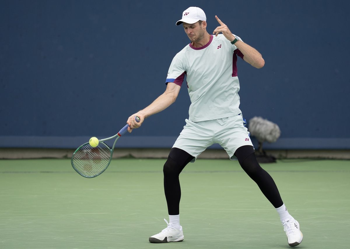 Aug 16, 2024; Cincinnati, OH, USA; Hubert Hurkacz of Poland returns a shot during his match against Flavio Cobolli of Italy on day five of the Cincinnati Open. Mandatory Credit: Susan Mullane-Imagn Images