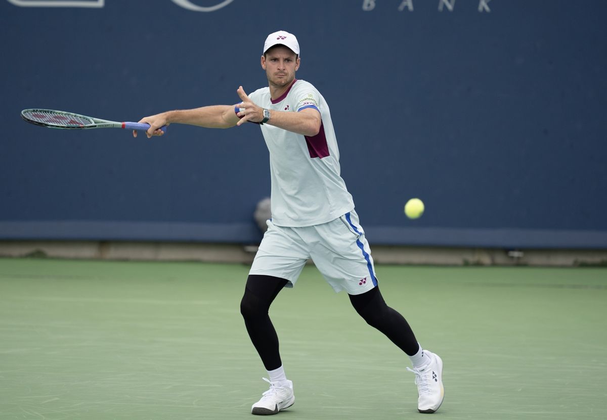 Aug 16, 2024; Cincinnati, OH, USA; Hubert Hurkacz of Poland returns a shot during his match against Flavio Cobolli of Italy on day five of the Cincinnati Open. Mandatory Credit: Susan Mullane-Imagn Images