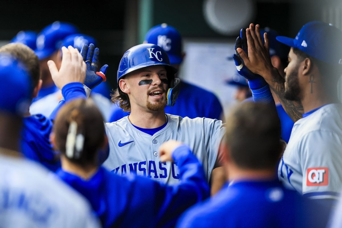 Aug 16, 2024; Cincinnati, Ohio, USA; Kansas City Royals shortstop Bobby Witt Jr. (7) high fives teammates after hitting a solo home run in the fourth inning against the Cincinnati Reds at Great American Ball Park. Mandatory Credit: Katie Stratman-USA TODAY Sports